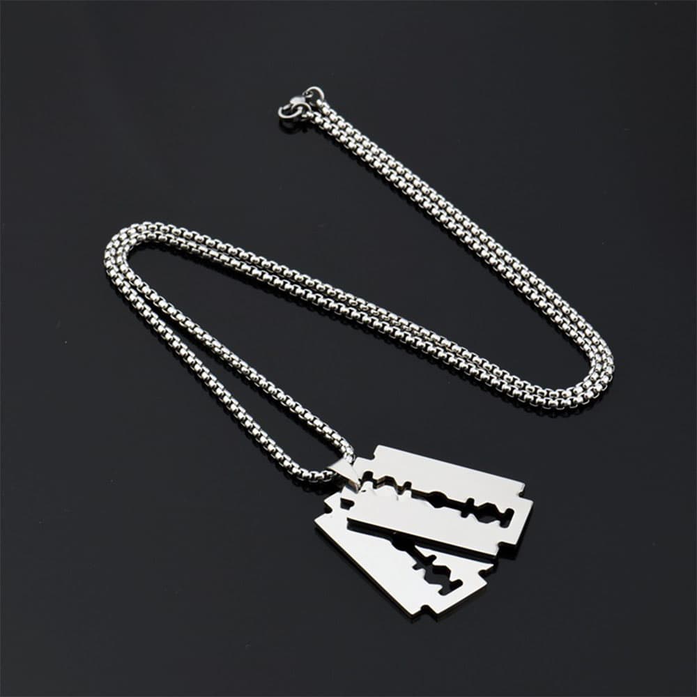 Men's gothic hip hop razor blade necklace in silver stainless steel, displayed flat on a black background.