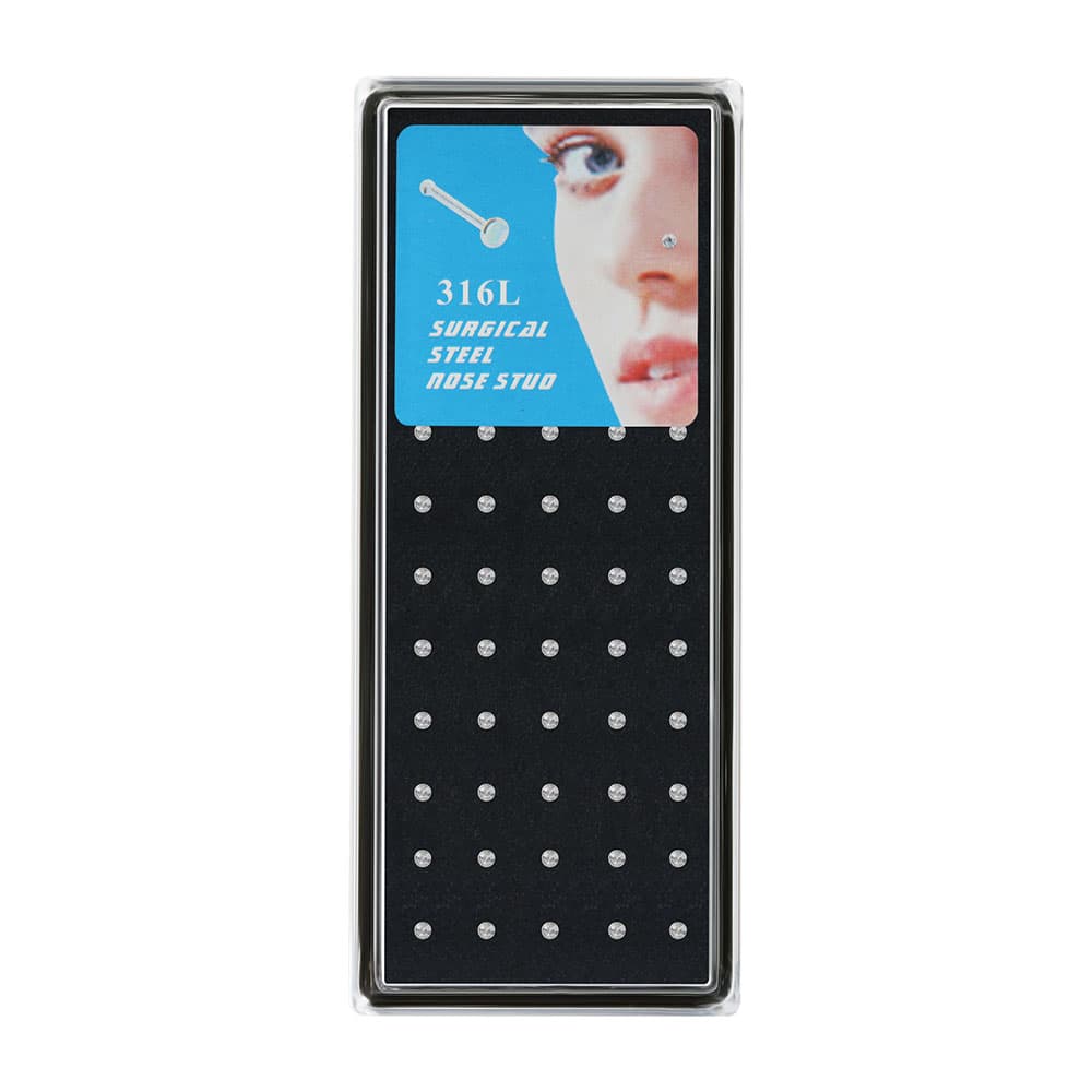 Pack of 60 pieces clear cubic zirconia 316L surgical steel straight bone nose studs arranged uniformly in a black display case.