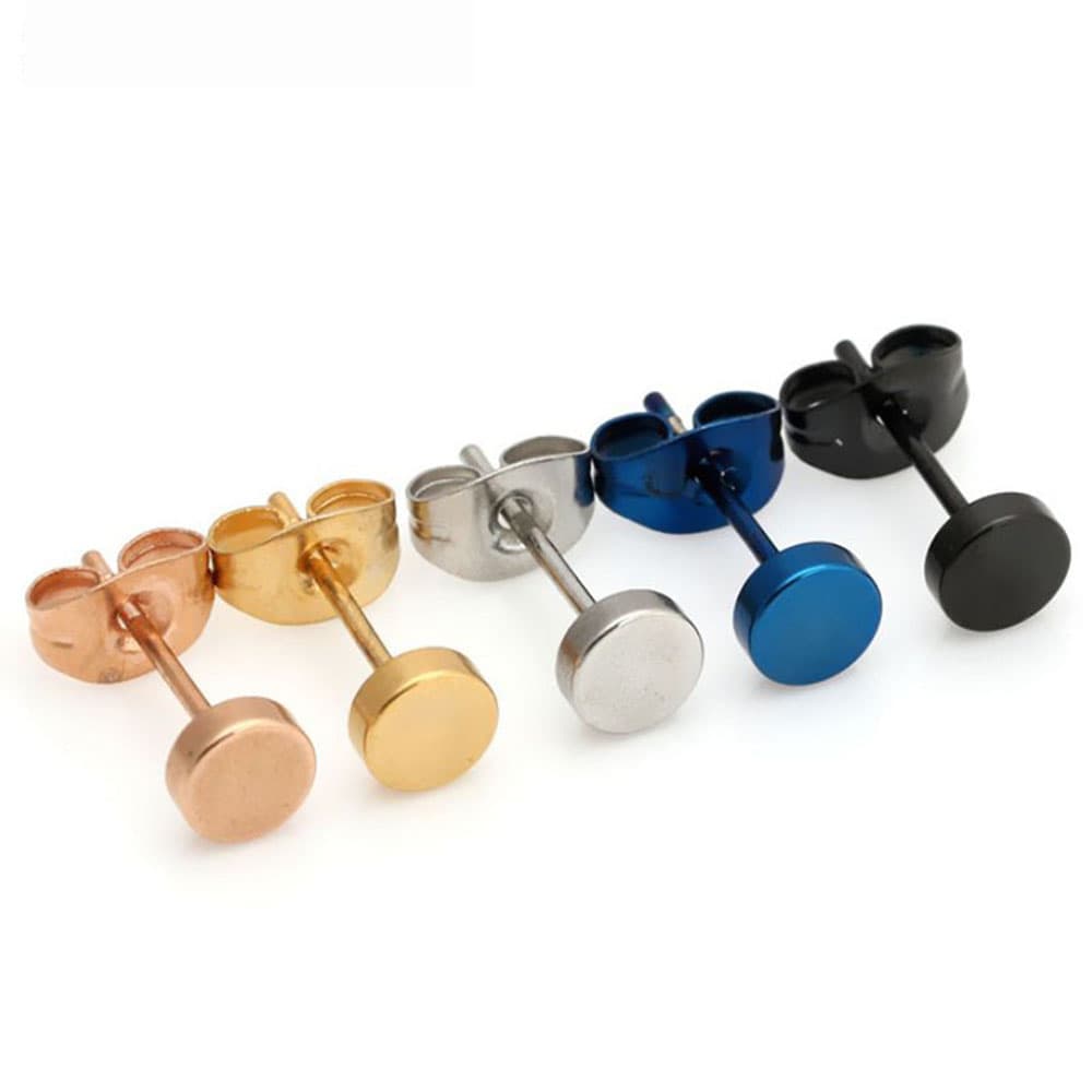 Custom stainless steel round disc flat top stud earrings lined up diagonally in rose gold, yellow gold, classic silver, metallic blue, and matte black finishes.