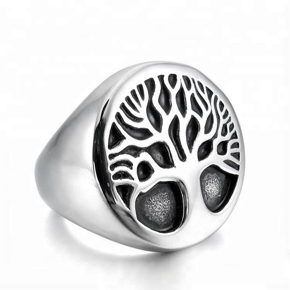 Men's vintage stainless steel Tree of Life signet ring with an oval face and oxidized black detailed Celtic roots and branches on a white backdrop.