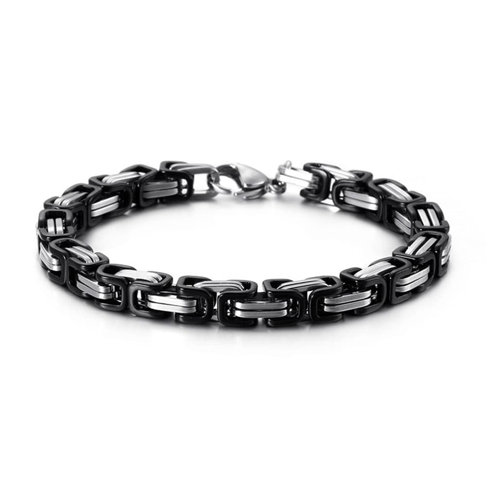 High-contrast two-tone byzantine link bracelet combining black carbon-coated loops with classic polished silver steel links.