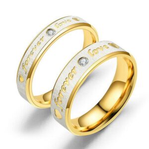 A matching pair of two-tone stainless steel couple rings featuring a wider band and a slimmer band engraved with Forever Love and inlaid with cz crystals.