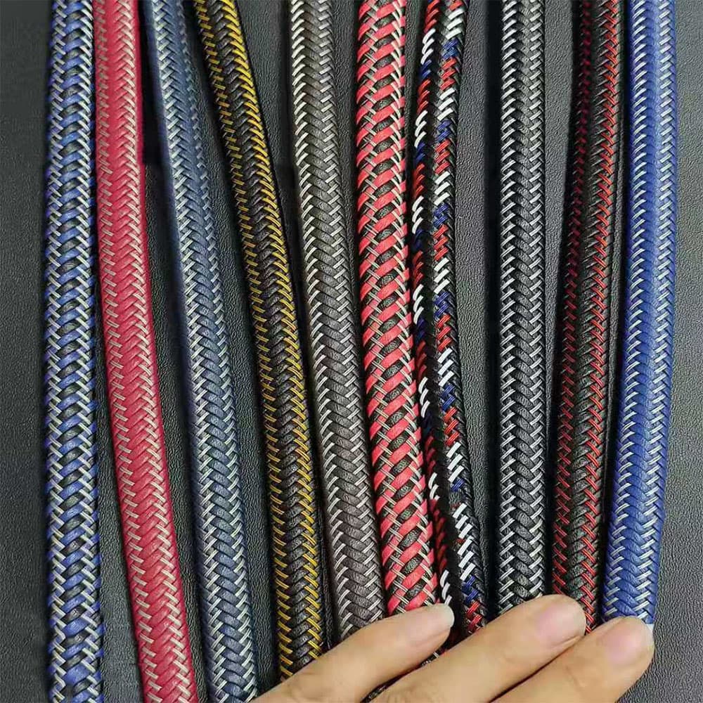 Custom color options of braided genuine leather cord interwoven with colored stainless steel wire for wholesale jewelry manufacturing.
