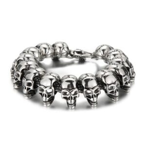 Heavy men's punk stainless steel skeleton skull head chain bracelet with detailed 3D skulls in an antique silver finish.