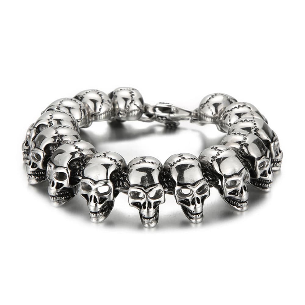 Heavy men's punk stainless steel skeleton skull head chain bracelet with detailed 3D skulls in an antique silver finish.