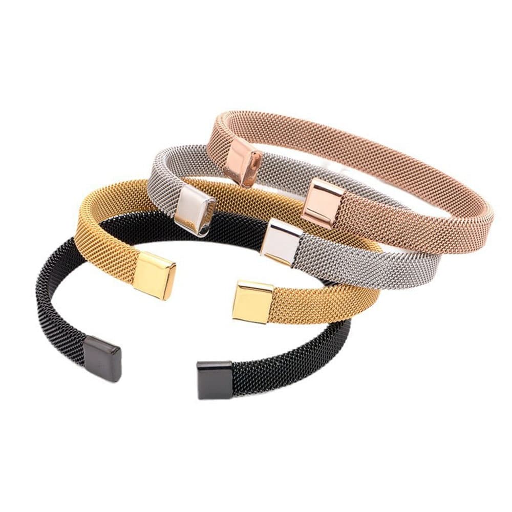 Stacked group view of unisex stainless steel mesh cuff bangle bracelets in four PVD colors: matte black, gold, silver, and rose gold with customizable end caps.