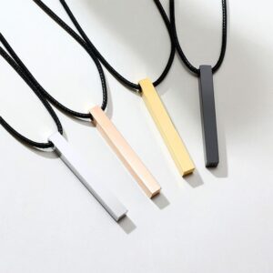 Four engravable square pillar bar pendants in silver rose gold gold and matte black stainless steel on black leather cords.