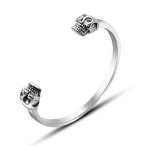 Men's punk stainless steel open cuff bracelet featuring detailed double skull finials on a white background.