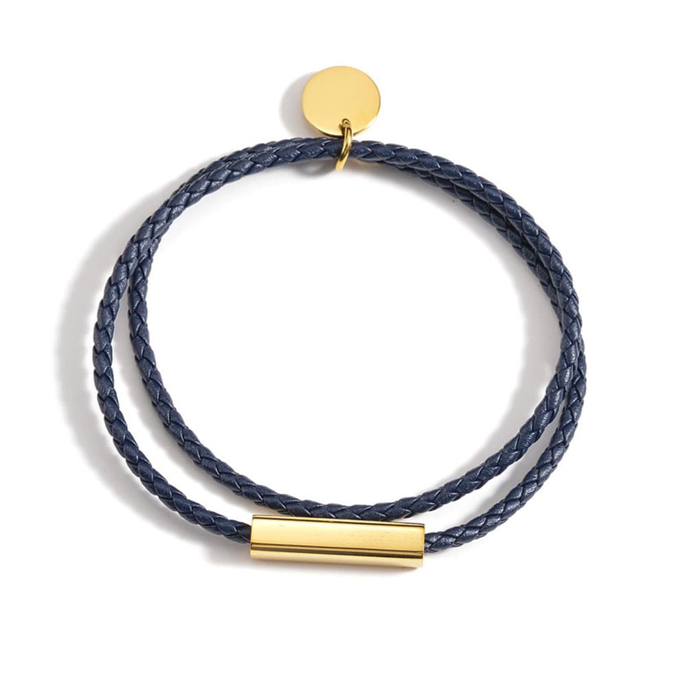 Personalized navy blue braided genuine leather bracelet featuring an 18k gold plated stainless steel engravable bar and round disc charm.